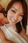 Cheery Chinese youthful Kazuha Kimura undressing and toying her unshaved pussy