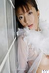 Beautiful Chinese angel with wild legs posing in white nylon nylons