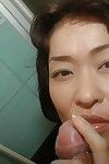 Saucy Japanese MILF gives a fleshly oral sex on a swollen weenie in the shower