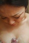 Saucy eastern MILF gives a physical tit and oral play in the bathroom