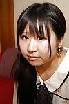 Shy oriental schoolgirl getting bare and exposing her wet cage of love in close up