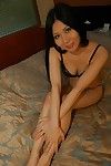 Small Chinese girl Hitomi Nagase getting unclothed and expanding her legs