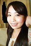 Smiley Japanese adolescent in nylons undressing and amplifying her hirsute clits