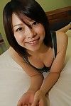 Smiley Chinese infant Maki Yoshikawa undressing and posing bare on the daybed