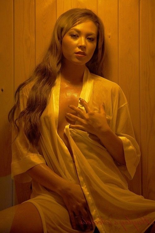 Beauty natalia in the sauna in her sheer white shirt
