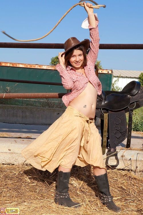 Petite cow girl revealing her diminutive tits and pretty pussy