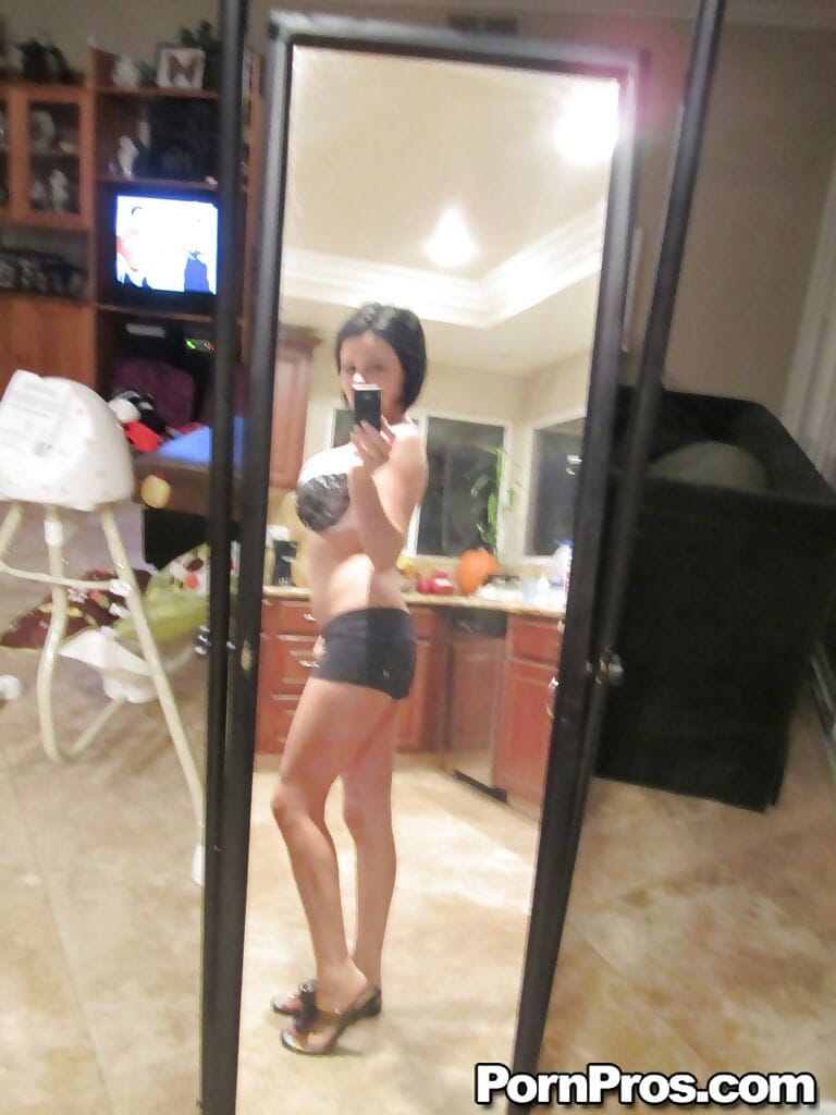 Dark haired babe Loni Evans snaps selfies while stripping in front of mirror