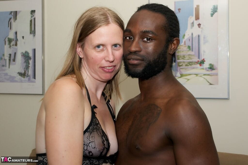 White amateur deepthroats her black lovers cock in lingerie ensemble