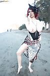 Busty redhead Tessa Fowler flashing her huge knockers on beach