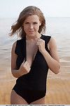 European beach babe Viola Bailey baring large teen tits for glamour shoot