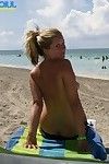 Awesome blonde with nice ass poses on public beach