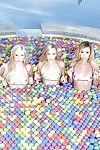 Lesbian pornstars strip off bikinis outdoors beside pool for all girl 3some