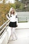 Blonde pornstar Karla Kush posing topless outdoors in schoolgirl uniform