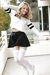 Blonde pornstar Karla Kush posing topless outdoors in schoolgirl uniform