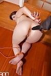 Bound BDSM model Lucia Love undergoing nipple torture and bare ass spanking