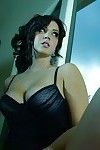 Foxy babe Alison Tyler revealing her ample bosoms and teasing her gash
