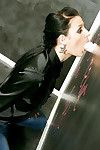 Clothed slut Elizabeth Small is having some fun with a gloryhole