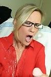 Fully clothed mature blonde in glasses gives a handjob and gets bukkaked