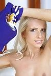 Frisky blonde cheerleader getting naked and exposing her slim curves