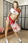 Naughty cheerleader Chastity Lynn revealing her tiny titties and shaved pussy