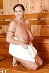 European milf with really big tits Laura Orsolya frolics in the sauna