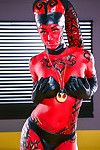 Cosplay model Kleio Valentien exhibiting pink pussy in long latex boots