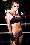 Tattooed MILF pornstar Kleio Valentien in shorts showing big tits in gym