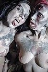Fetish models Brittany Lynn and Jessie Lee giving head in Zombie threesome