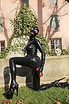 Fetish babe Lucy Latex posing and masturbating her cunt outdoor