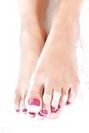 Leggy broad Felicia Kiss having painted toes sucked before giving footjob