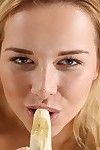 Naughty blonde babe pisses over a banana