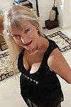 Blonde granny Lisa Cognee demonstrates her shaved pussy in close up
