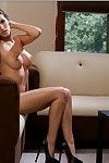Leggy babe Kortney Kane slipping off her lingerie and posing naked