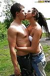 Naughty amateur brunette stripping and kissing with her friend outdoor