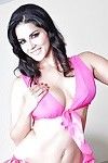 Indian milf babe Sunny Leone demonstrates her big tits in high heels