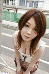 Asian schoolgirl Nami Ogawa revealing her massive bosoms and nice fanny