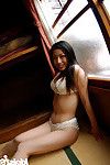 Graceful asian babe Ran Asakawa slipping off her lingerie