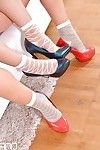 Leggy lesbians Aylin Diamond and Alexa Tomas pose in high heels and shorts