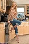 Seductive mature lady with big tits Julia Ann stripping in the kitchen