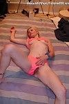 Blonde skinny housewife posing in pinky underwear in the bedroom