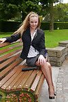 Cute blonde is outdoors in tall black high heel shoes and sexy n