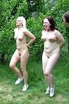Outdoor spanking training camp of two whipped female slaves
