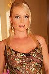 Sexy mature lady Silvia poses erotically in a classy see-through dress