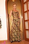 Sexy mature lady Silvia poses erotically in a classy see-through dress