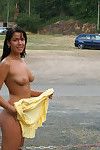 Frisky brunette amateur exposing her sexy curves in the public place