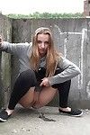 Blonde teen Suzzie baring her pussy lips and sexy ass and pissing in public