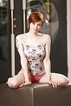 Short haired redhead in pink panties unveiling full all natural breasts