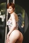 Short haired redhead in pink panties unveiling full all natural breasts