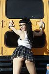 Hot gothic schoolgirl in glasses flashing on schoolbus