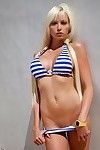 Doll-face teenage blonde with big tits Rikki Six slipping off her bikini